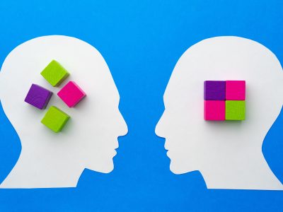 Papercut silhouette of human head with colorful constructor pieces